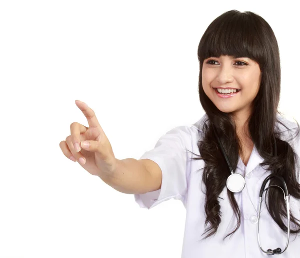 Unga kvinnliga kirurgen pekar på copyspace — Stockfoto