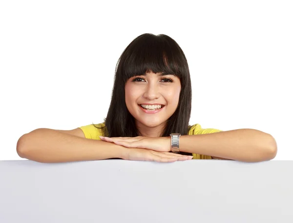 stock image Beautiful businesswoman holding a blank billboard