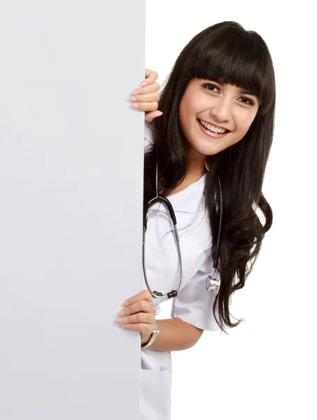Beautiful woman doctor with an empty board — Stock Photo, Image