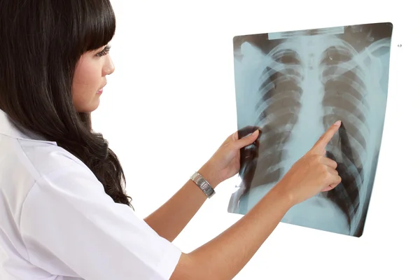 Female doctor looking at an x-ray. — Stock Photo, Image