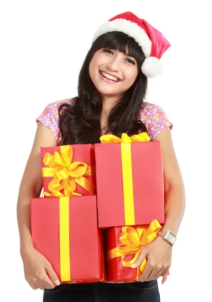 Рождественская женщина с подарками в шляпе Санты — стоковое фото