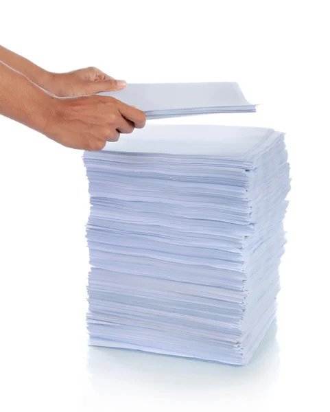 Hand put paper on stack of paper. — Stock Photo, Image