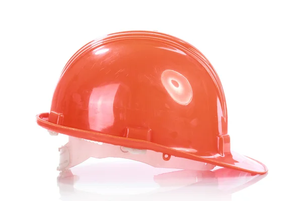 Апельсиновый шлем для строителя — стоковое фото