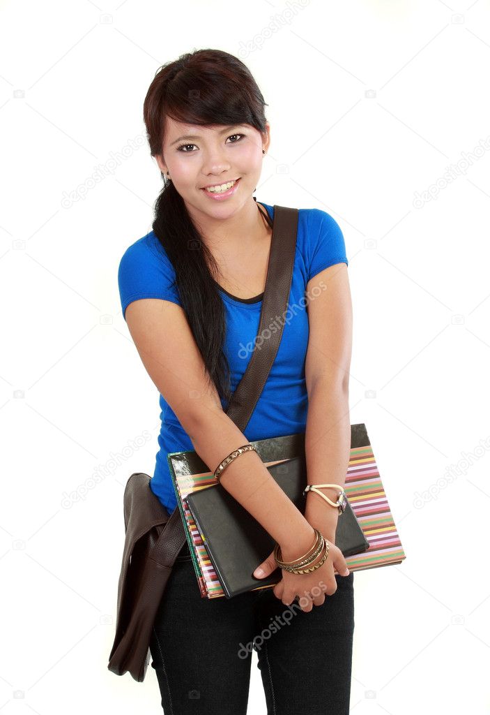 Cute happy student holding open textbook