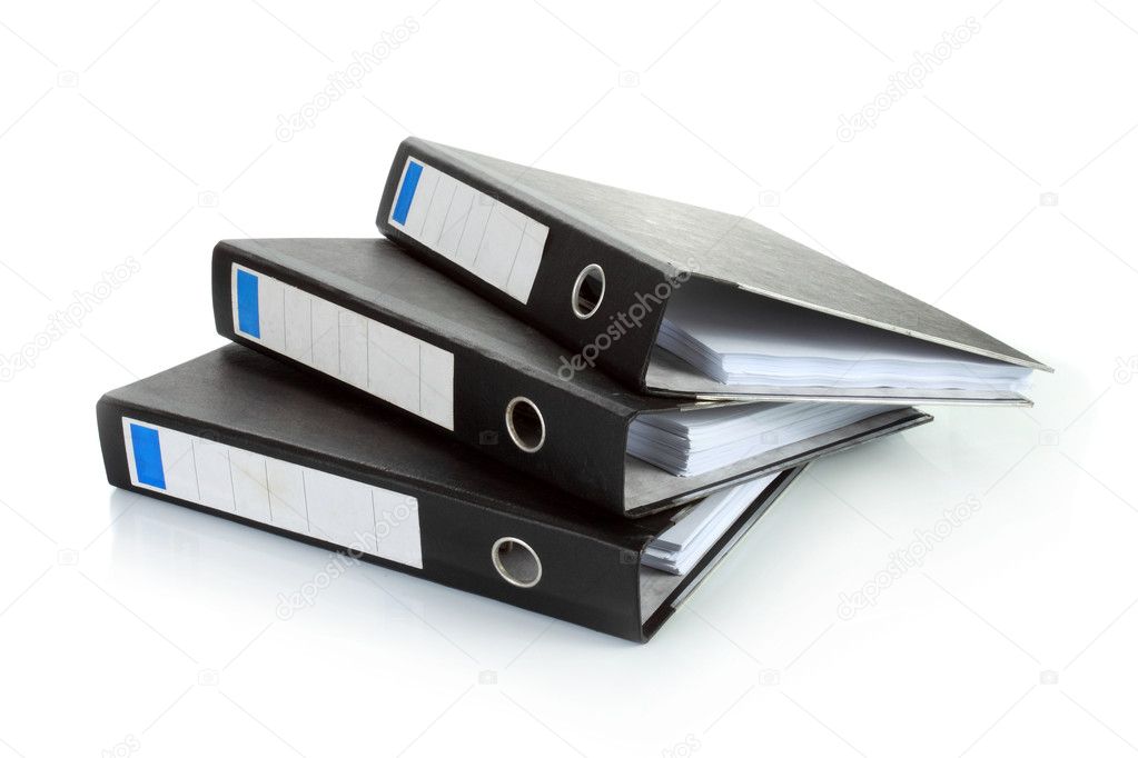 Stack of documents in binders