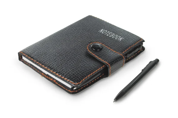 Fekete notebook és a toll — Stock Fotó