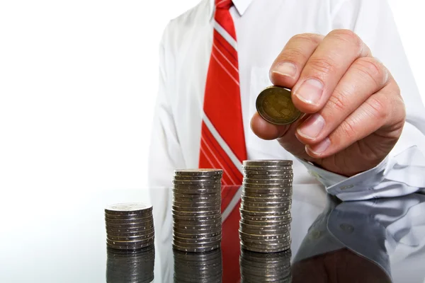 Businessman with coins — Stock Photo, Image