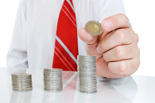 Businessman with coins — Stock Photo, Image