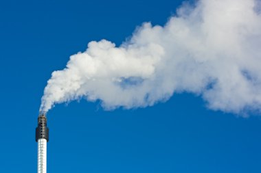 Smoke against blue sky