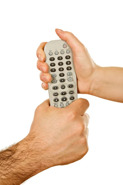 Manos sosteniendo un mando a distancia — Foto de Stock