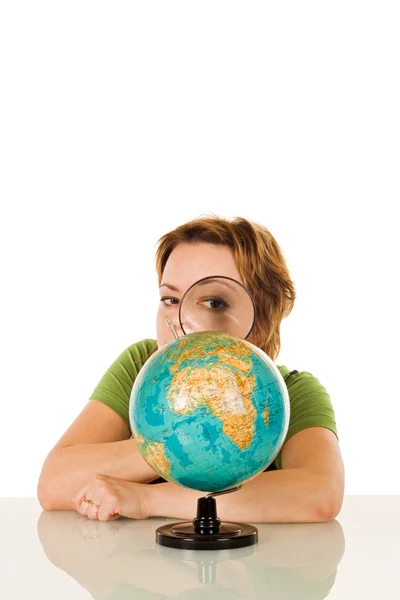 Woman looking at globe — Stock Photo, Image