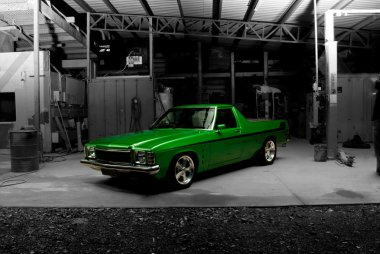 Muscle Car in workshop clipart