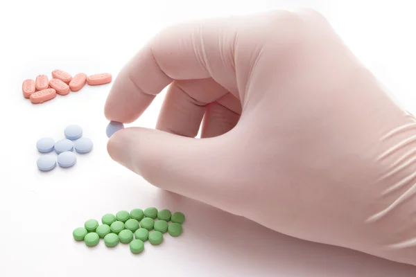 Picking blue pill — Stock Photo, Image