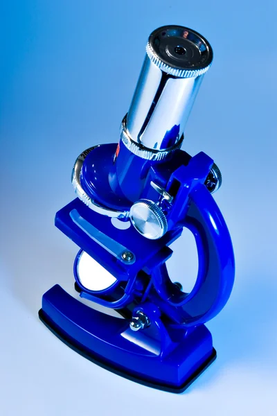 Microscope in blue light — Stock Photo, Image