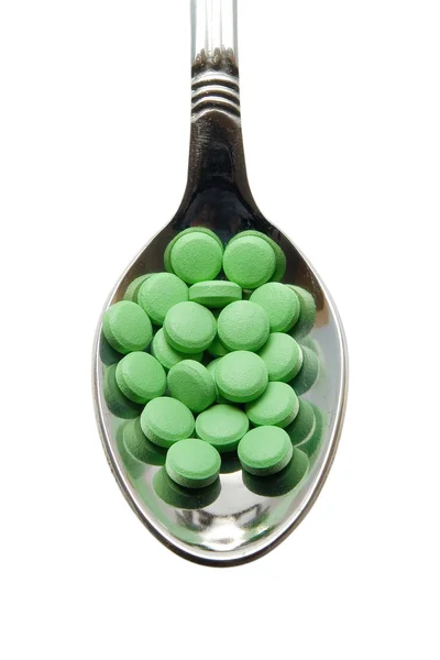 Pills on a spoon — Stock Photo, Image