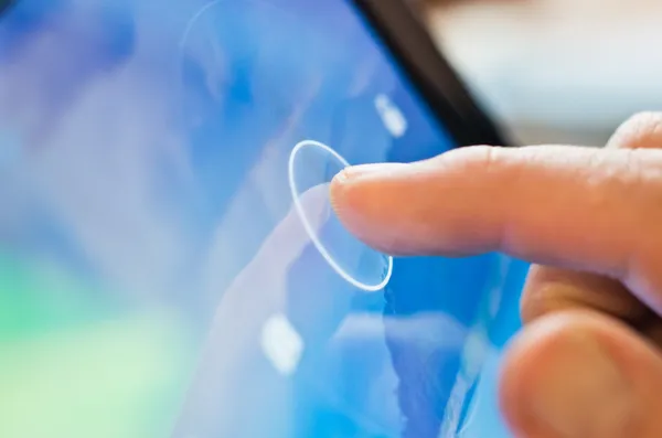 Tablet-Gerät mit Fingerberührung Stockbild