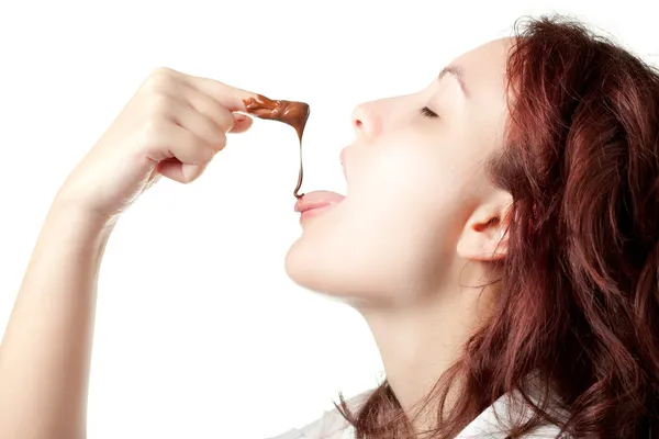 Mujer degustación chocolate propagación — Foto de Stock