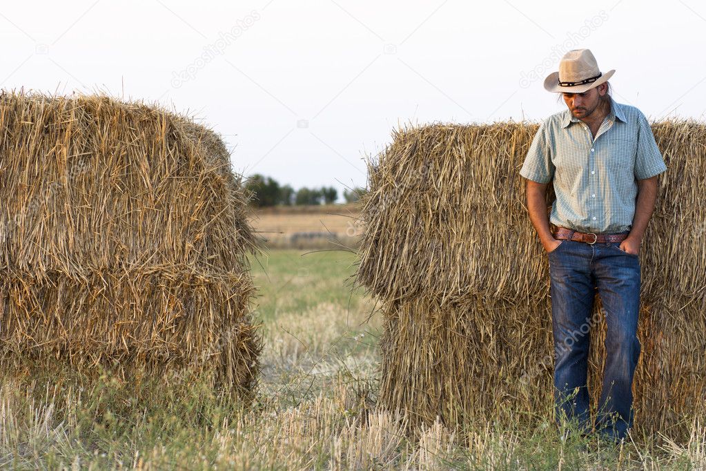 Farmer with Hay Bales