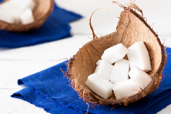 Stock image Coconut Pieces in a Shell