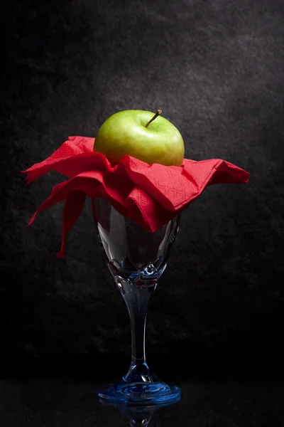 Green Apple on a Glass — Stock Photo, Image