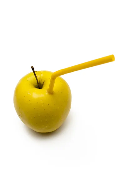 Gele appel met stro Rechtenvrije Stockfoto's