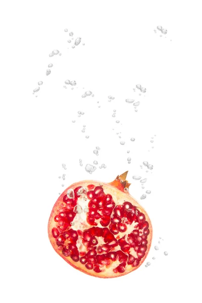 stock image Pomegranate in water with air bubbles