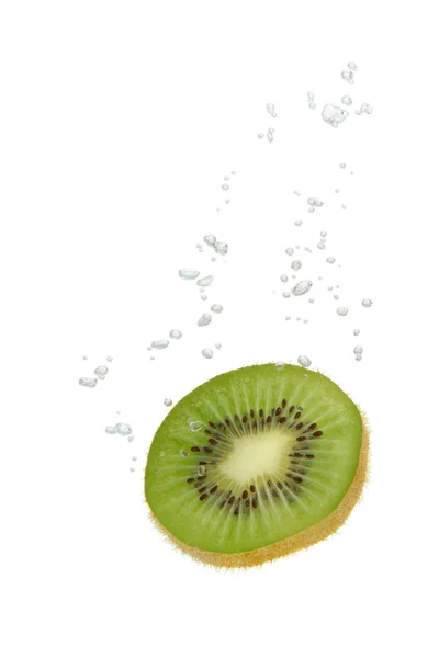 stock image Kiwi fruit in water with air bubbles