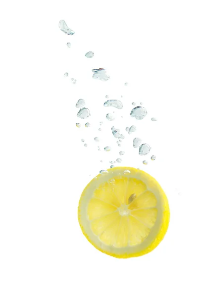 Lemon in water with air bubbles — Stock Photo, Image