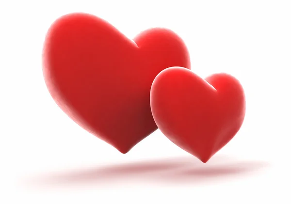 Dvojice zářivě červené srdce — Stock fotografie
