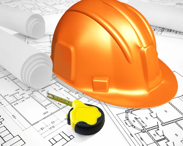 stock image Helmet with ruler placed on blueprint of house