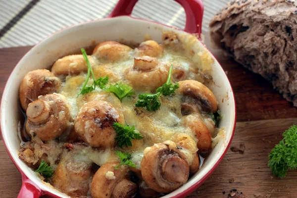 Mushrooms covered with melted cheese — Stock Photo, Image