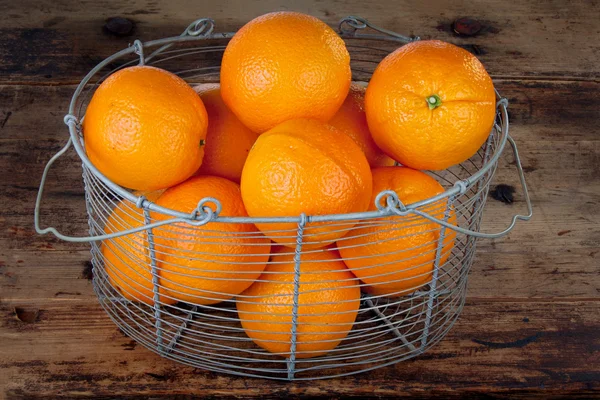 Oranges in a basket — Stock Photo, Image