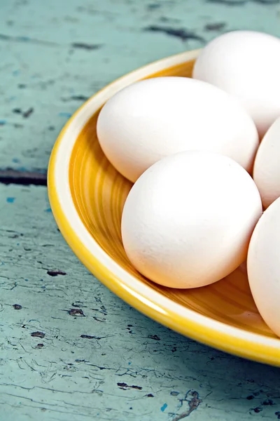 Eggs on a yellow plate — Stock Photo, Image