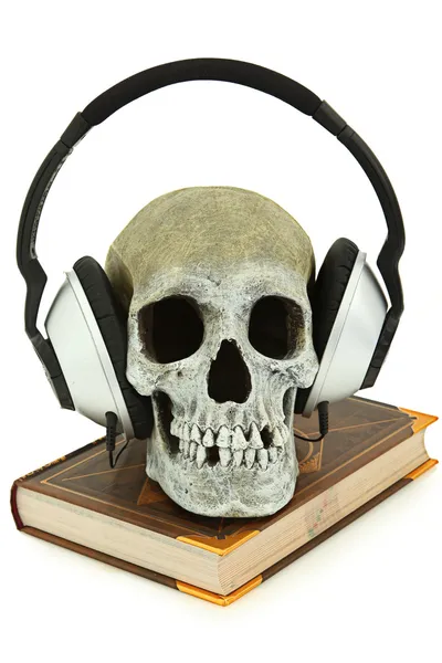 Audiobook Concept Human Skull with Headset on Book — Stock Photo, Image