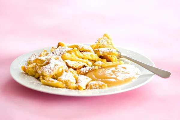 Austrian sweet dessert called kaiserschmarrn with apple sauce — Stock Photo, Image