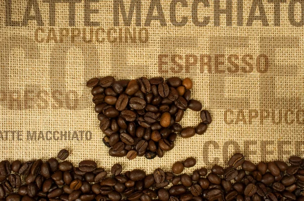 Чашка кави на мішковині Стокове Фото