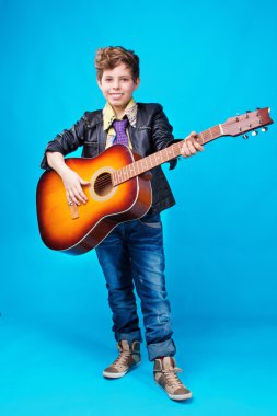 A boy with guitar clipart