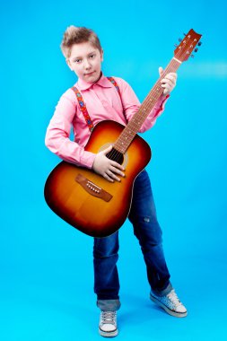 A boy with guitar clipart