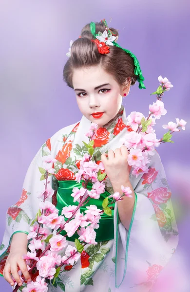 Un giapponese con ramo di un sakura — Foto Stock
