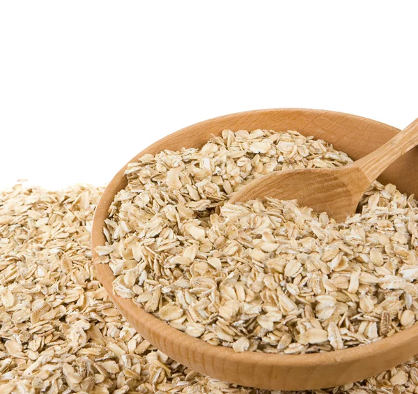 Cereals oatmeal flake in wood plate — Stock Photo, Image