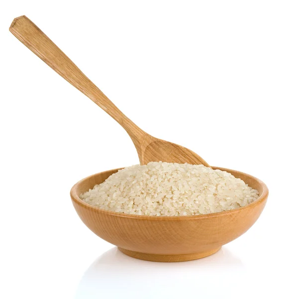 Ahşap tabak pirinç ve kaşık — Stok fotoğraf