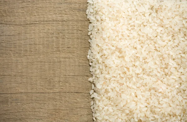 Rice grain on wood — Stock Photo, Image