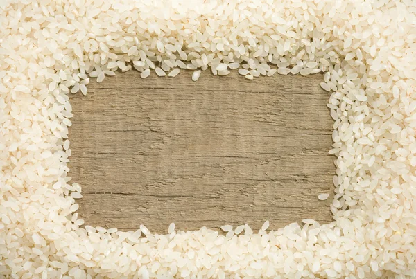 Рисове зерно на фоні дерева — стокове фото