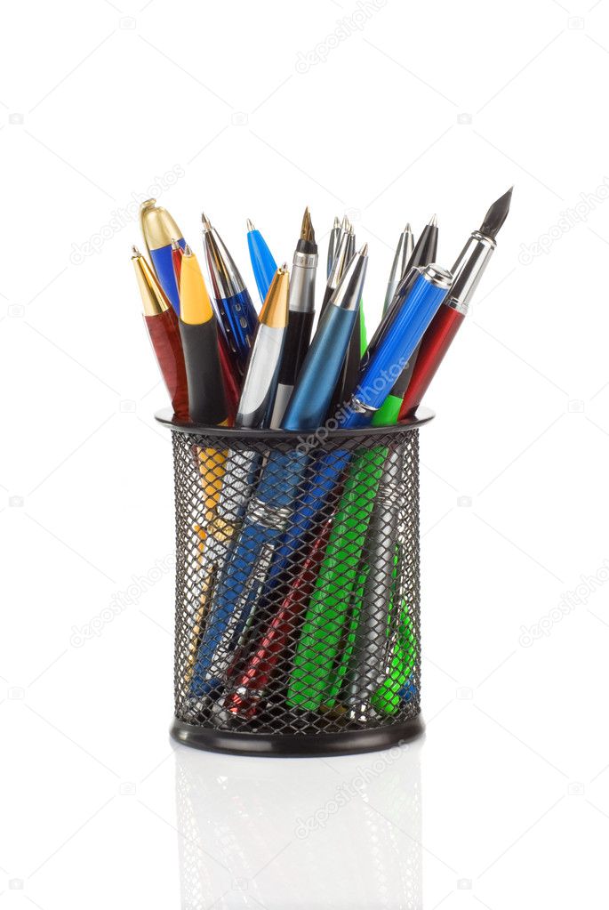 Pens in holder basket on white