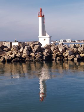 Romantic lighthouse in the south of France clipart