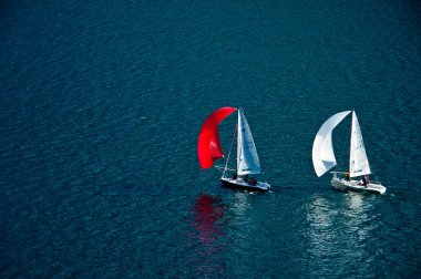Sailboats on lake Lugano clipart