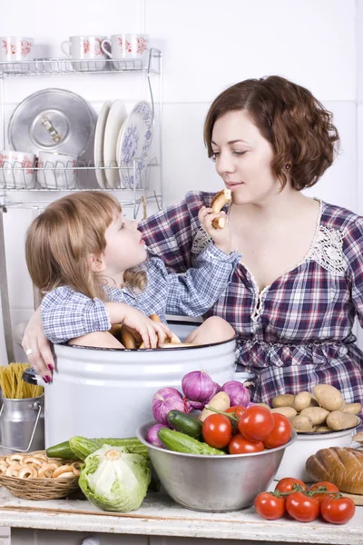 stock image Mother with the daughter in kitchen in the village