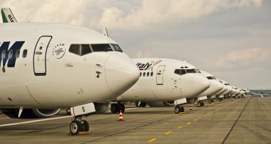 Group of airplanes parked at the airport clipart