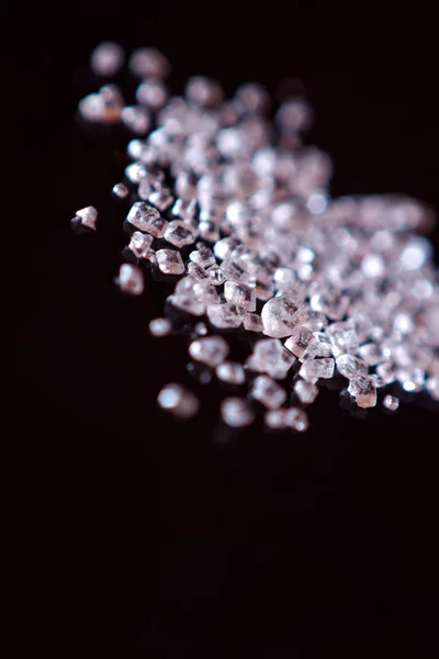 Tiny crystals over black background — Stock Photo, Image