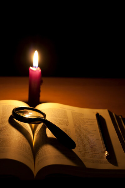 Bible and candle background